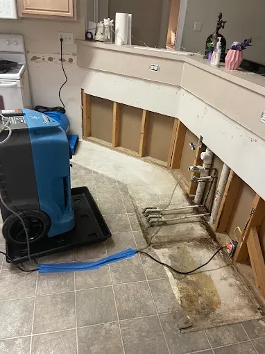 Drying equipment beside removed lower bathroom cabinetry