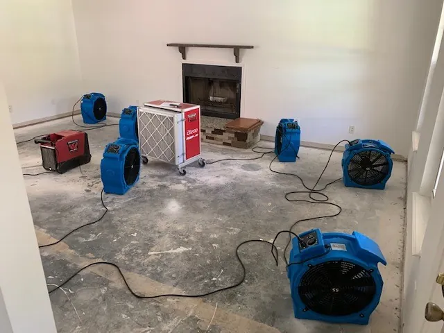 Multiple air movers and dehumidification equipment in a room